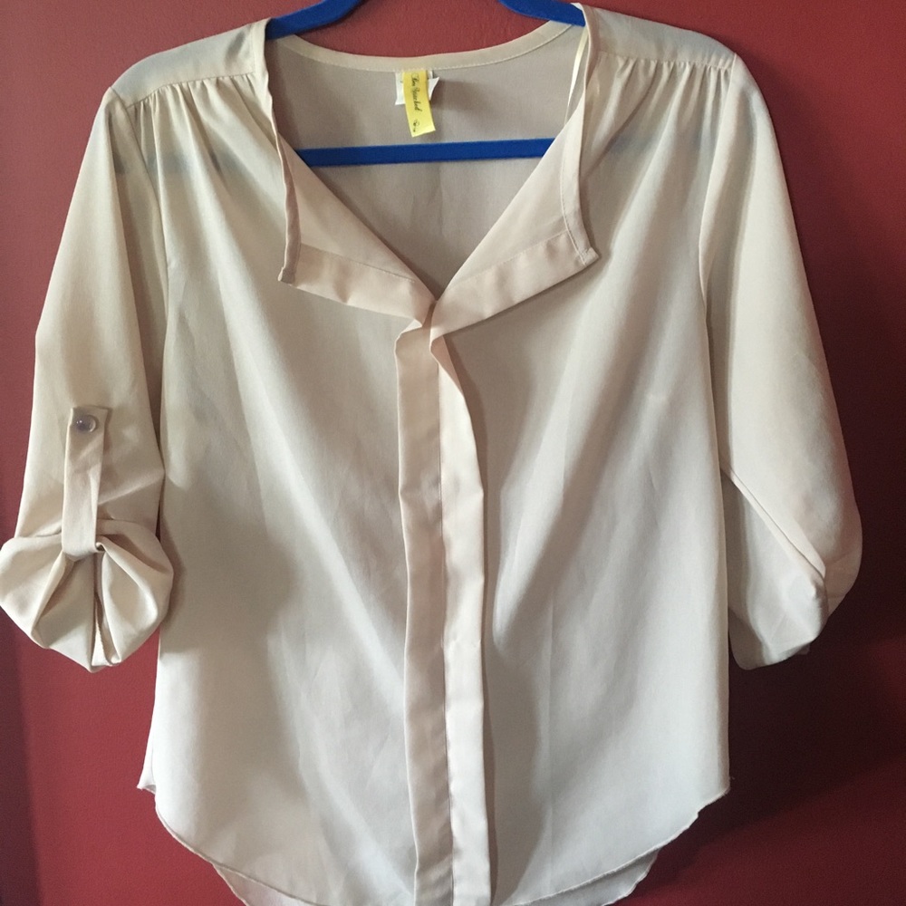 Francesca’s off-white blouse